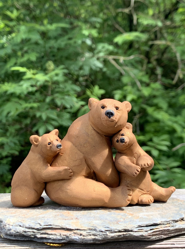 Brown Bear With Cubs Sitting